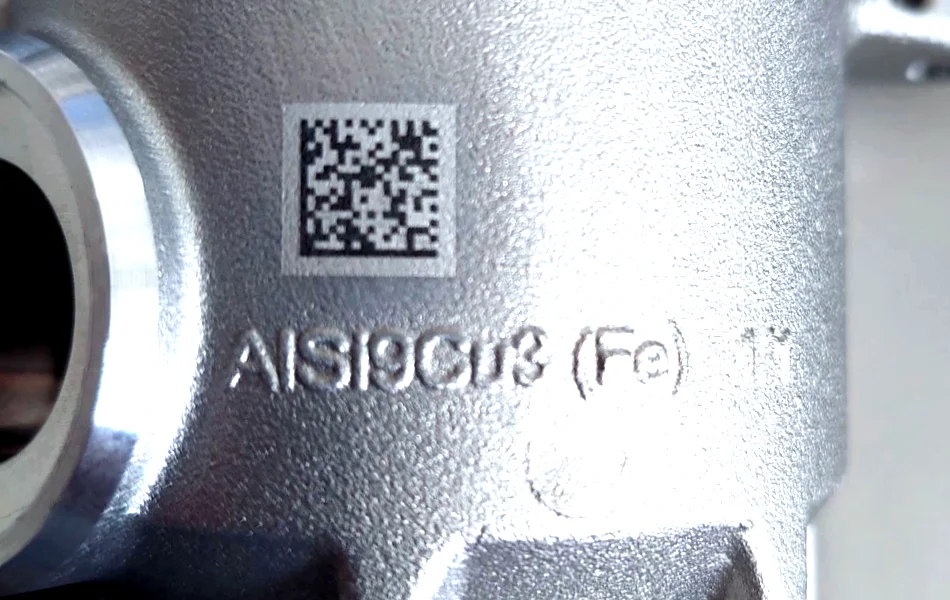 High-contrast DataMatrix code laser engraved on a metal component for permanent part identification and traceability.